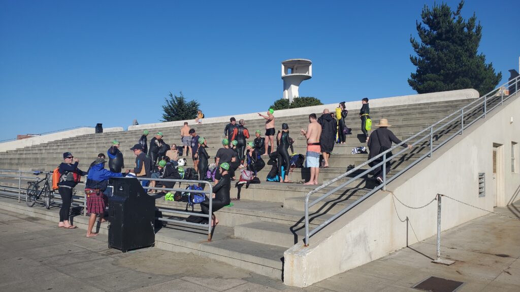 Open water swim group changes and packs open water swim buoys at aquatic park
