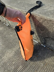 Second fold of the open water swim buoy dry bag closure 