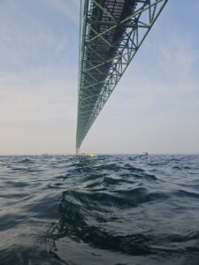 View of the south tower and main bridge span, looking back from north tower at water level during the Mackinac Bridge Swim